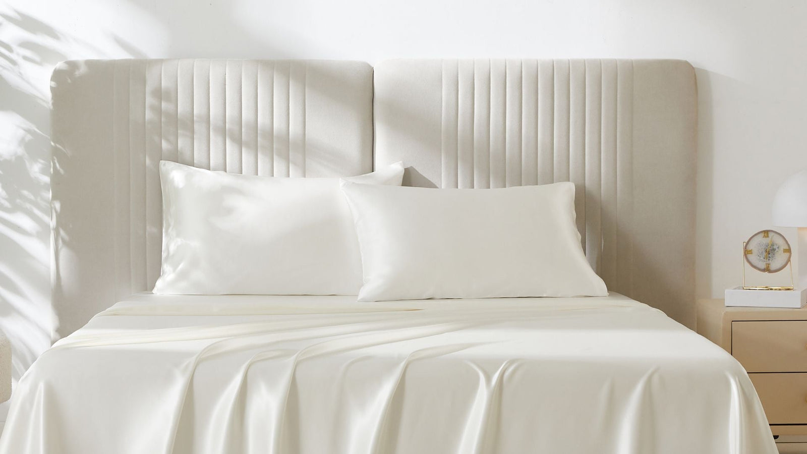 A beautiful bed with two ivory silk pillowcases from Mulberry Park Silks