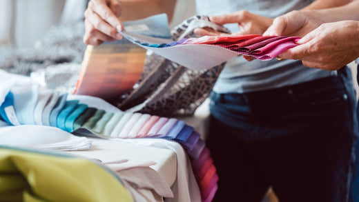 Two people look at different fabric swatches