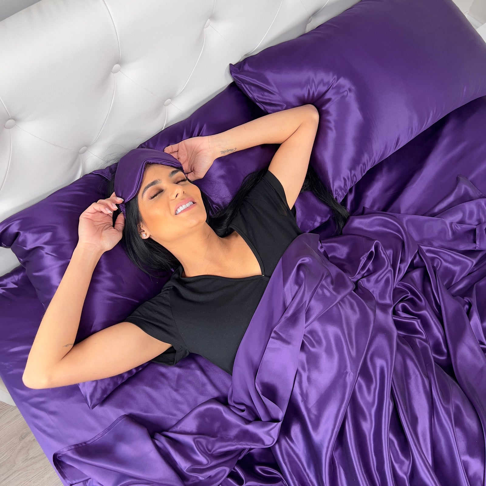 Elegant 22 Momme Silk Sheets Set in Plum color displayed on a beautiful bed with silk pillows
