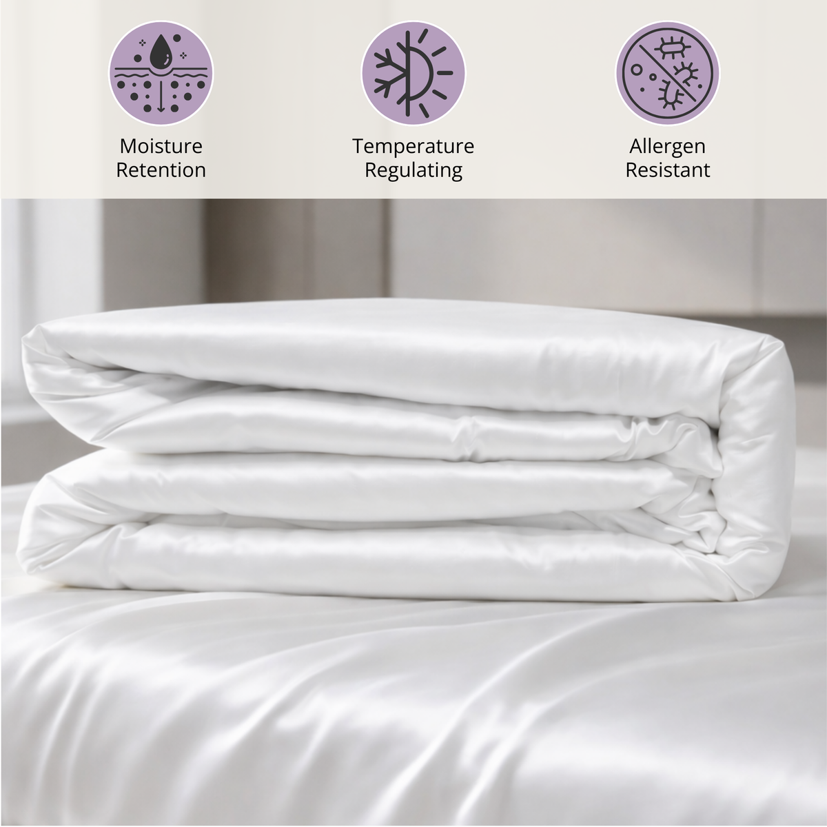 A folded white Mulberry silk comforter on a bed with icons for moisture retention, temperature, and allergen resistance.