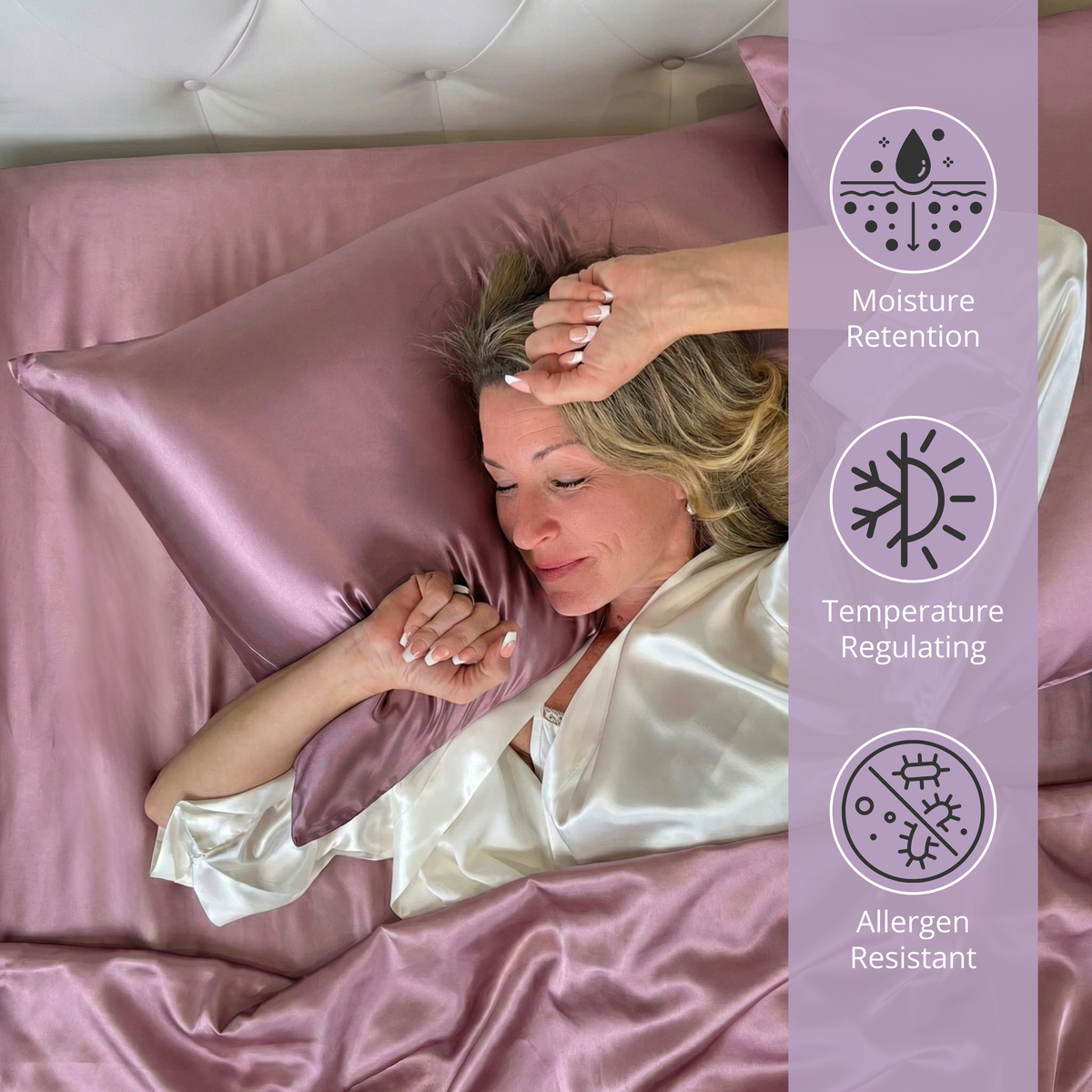 A woman in a white robe lies on a pink Mulberry silk sheet set, with icons for moisture retention and allergen resistance.