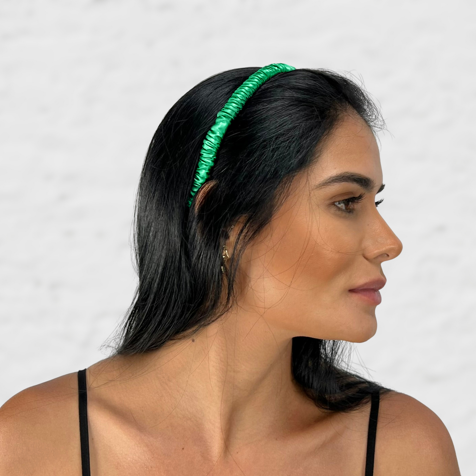 Close-up of a woman styling hair with a soft and elegant looking mulberry park silk headband