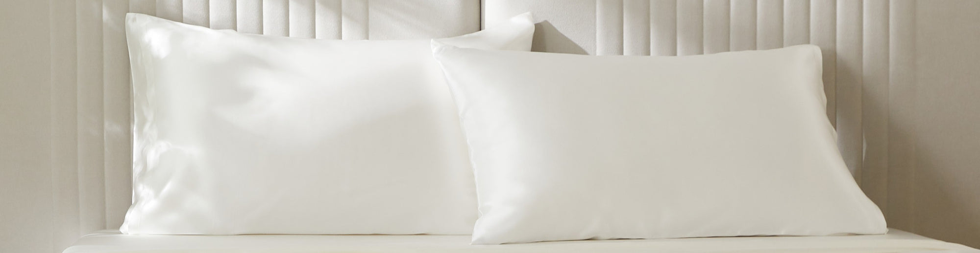 Mulberry Park Silks pure natural ivory silk pillowcases displayed on bed — luxury silk pillowcase collection.