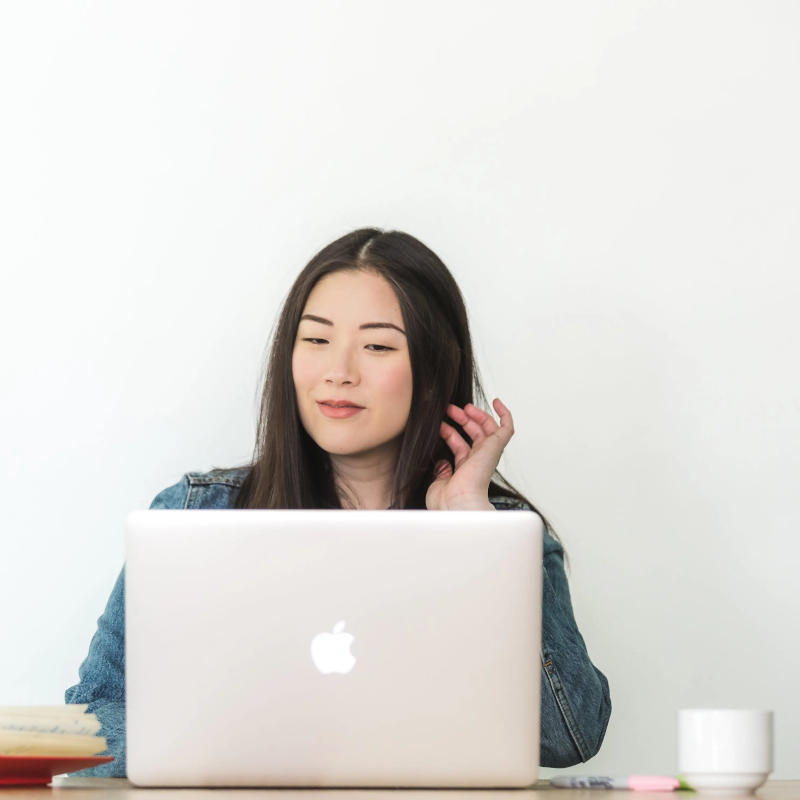 Woman on her laptop shopping on Mulberry Park Silks