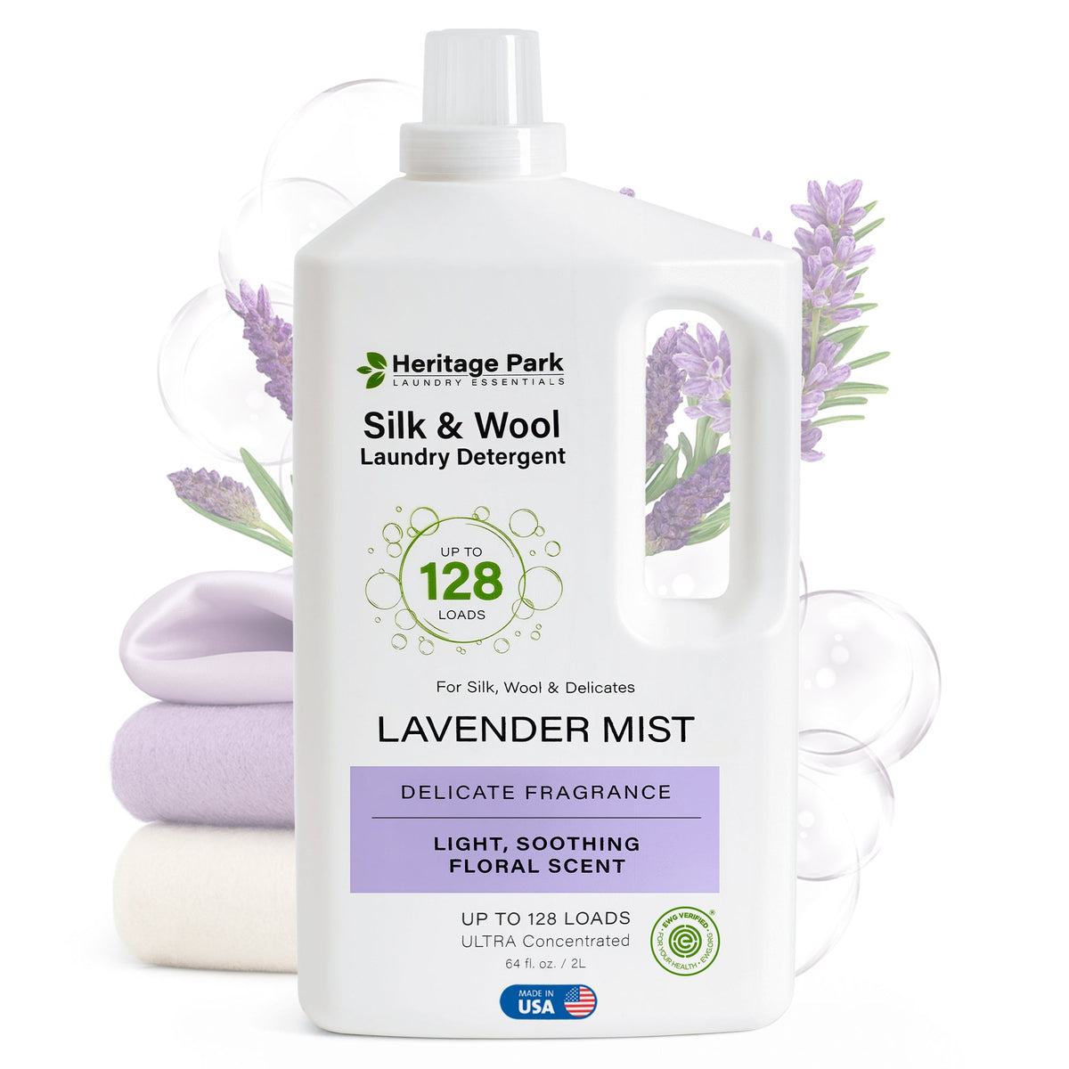 64oz bottle of Lavender Mist scent Heritage Park Luxury for Silk and Wool Laundry Detergent with flowers in background