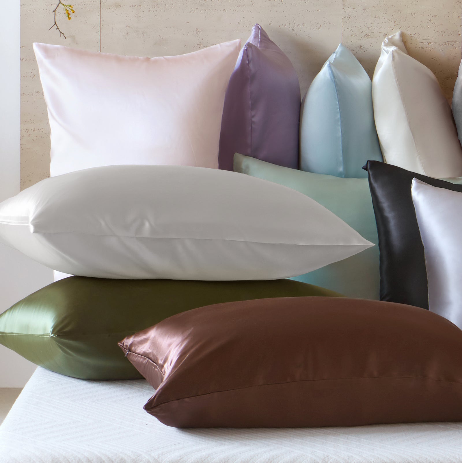 Mulberry Park Silks 19 Momme silk pillowcases in assorted colors including white, ivory, lilac, green, and chocolate brown.